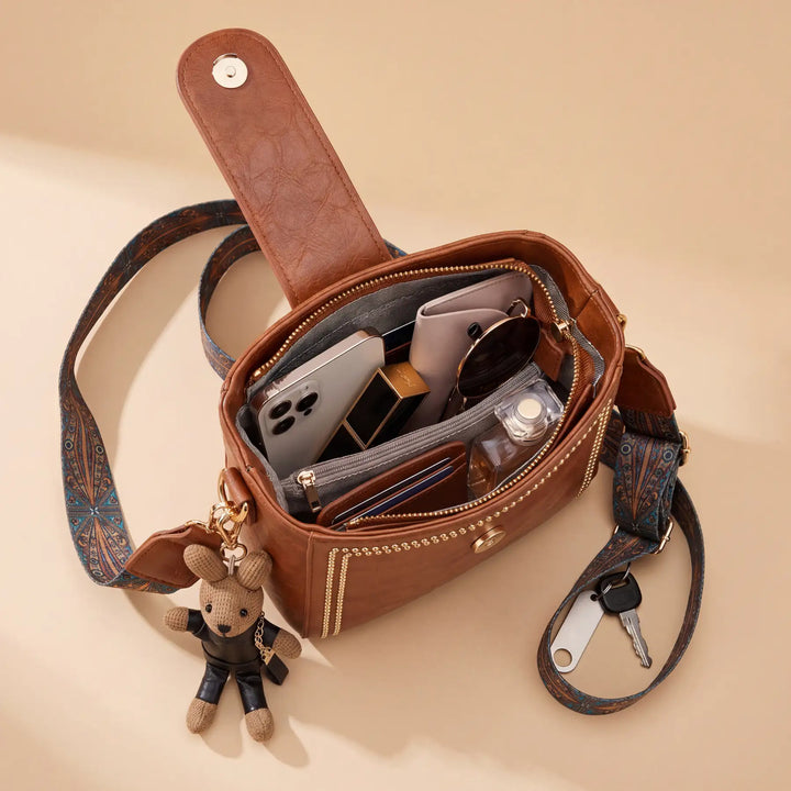 Bolso tipo Satchel + Muñeco Arion de obsequio