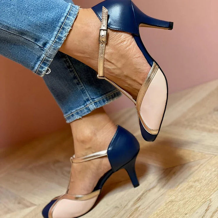 "TACONES RETRO T-BAR" se puede traducir como "TACONES RETRO T-BAR". Sin embargo, si deseas una versión más descriptiva, podrías usar "TACONES RETRO ESTILO T-BAR".