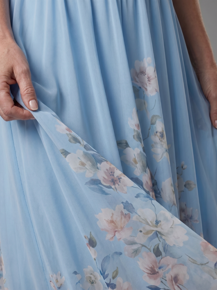 Clarissa | Vestido midi sin mangas con escote en V y dobladillo floral suave