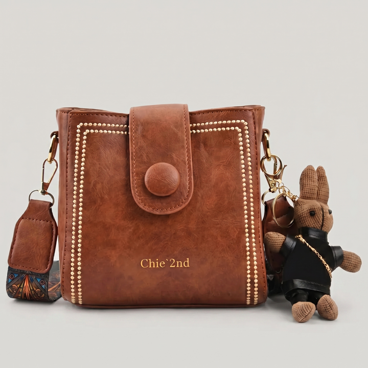 Bolso tipo Satchel + Muñeco Arion de obsequio
