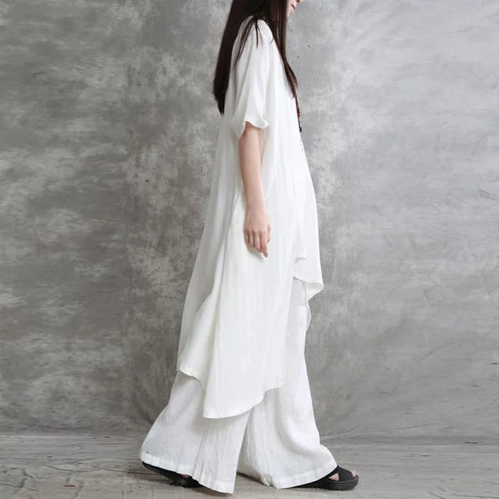 Sabrina | Conjunto de dos piezas: blusa holgada de manga tres cuartos y pantalón de pata ancha con cintura elástica.