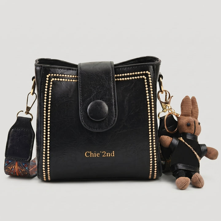 Bolso tipo Satchel + Muñeco Arion de obsequio