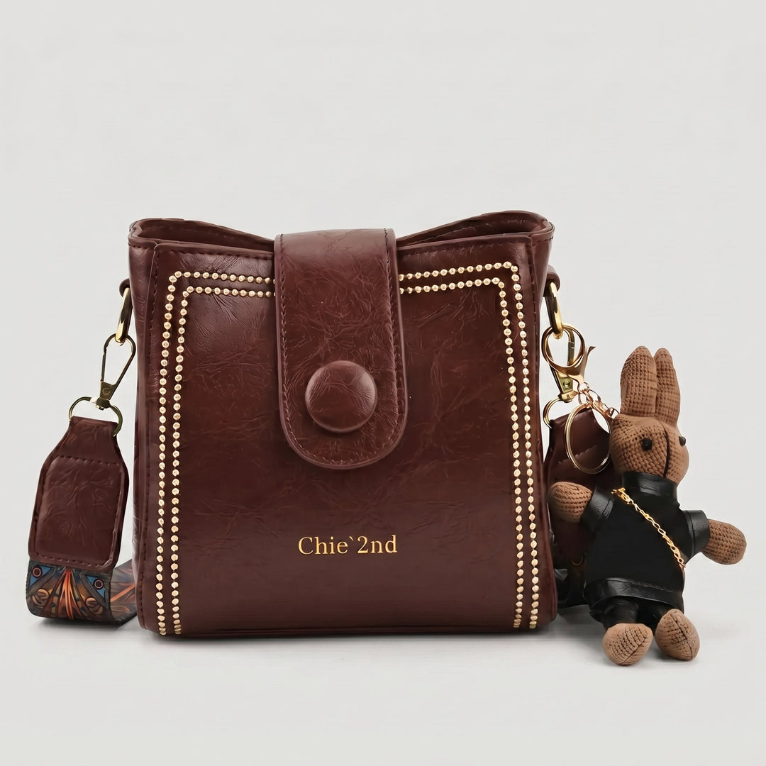 Bolso tipo Satchel + Muñeco Arion de obsequio