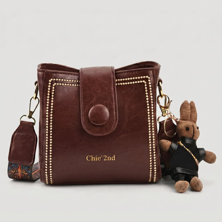 Bolso tipo Satchel + Muñeco Arion de obsequio