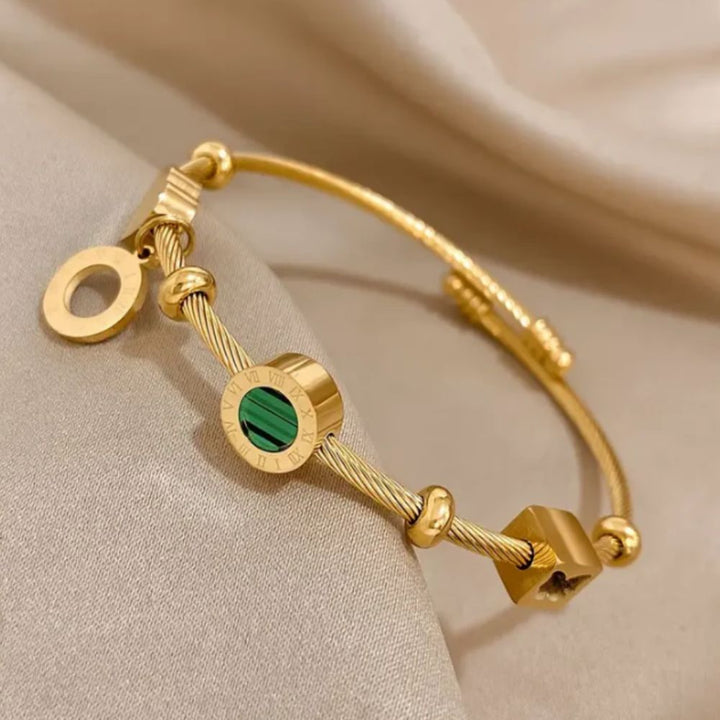 "Pulsera de Oro Emerance" (The title is already in Spanish and does not require translation.)