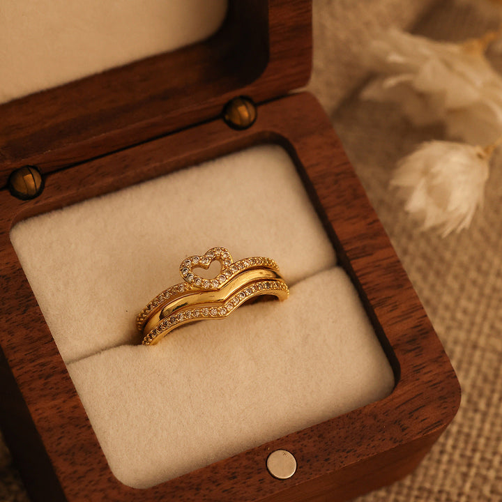 "Anillos Apilables Shining Love Wish Bone" se puede traducir como "Anillos Apilables Shining Love Hueso de Deseo".