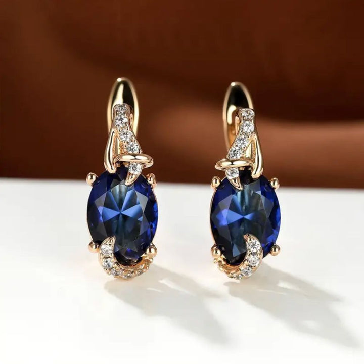 "Pendientes Royal Midnight Drop" se puede traducir como "Pendientes Royal Midnight Caída". Sin embargo, si deseas mantener el nombre "Royal Midnight" en inglés, podrías optar por: "Pendientes Royal Midnight Drop".